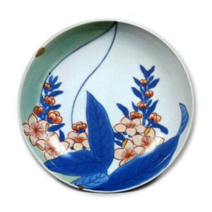 Dish with peach blossom design, underglaze blue. overglaze enamels. and partial celadon glaze