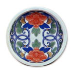 Dish with floral scroll design, underglaze blue. overglaze enamels