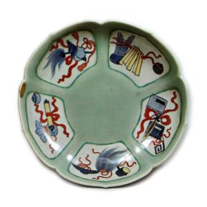 Dish with ¨various treasures" design, underglaze blue, overglaze enamels. and celadon glaze on reserved area