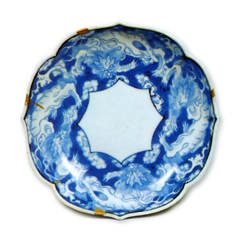 Dish with dragon design. blue and white