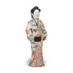 Figure of woman, enamelled ware