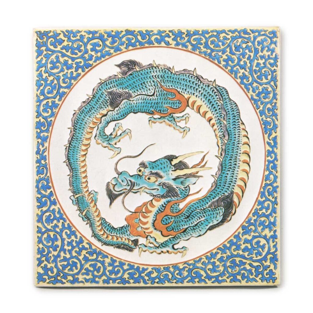 Plaque with rounded dragon design, enamelled ware