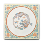 Plaque with rounded dragon design, enamelled ware