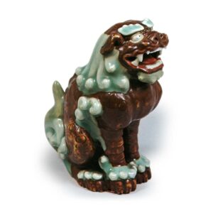 Figure OT shishi, celadon glaze. and brown glaze reserved area