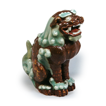 Figure OT shishi, celadon glaze. and brown glaze reserved area