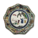 Nonagonal dish with design of Chinese figures on the rocks, enamelled ware