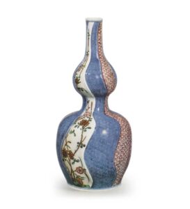 Gourd-shaped wine bottle with flowering grass design, enamelled ware