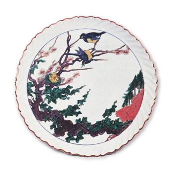Dish in the shape of open flower with design of two birds in tree, enamelled ware