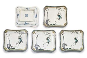 Set of small rectangular dishes with design of swallow on willow spray, enamelled ware