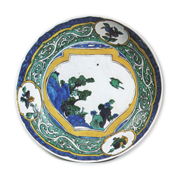 Large dish with design of jar showing landscape with a flying bird, enamelled ware