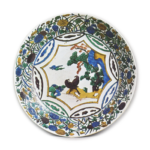 Large dish with design of landscape with two birds surrounded by various flowers, enamelled ware