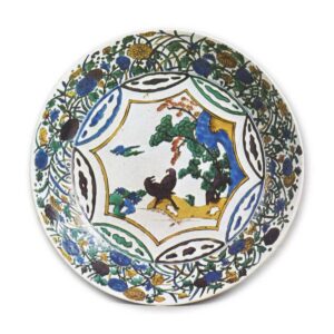 Large dish with design of landscape with two birds surrounded by various flowers, enamelled ware