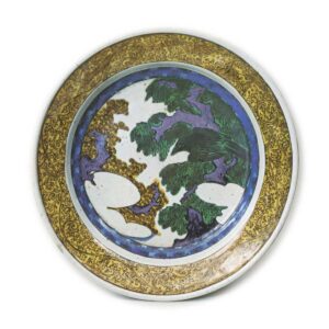 Large dish with hawk, tree and cloud design, enamelled ware