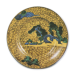 Large dish with design of seashore with pine-trees and houses,