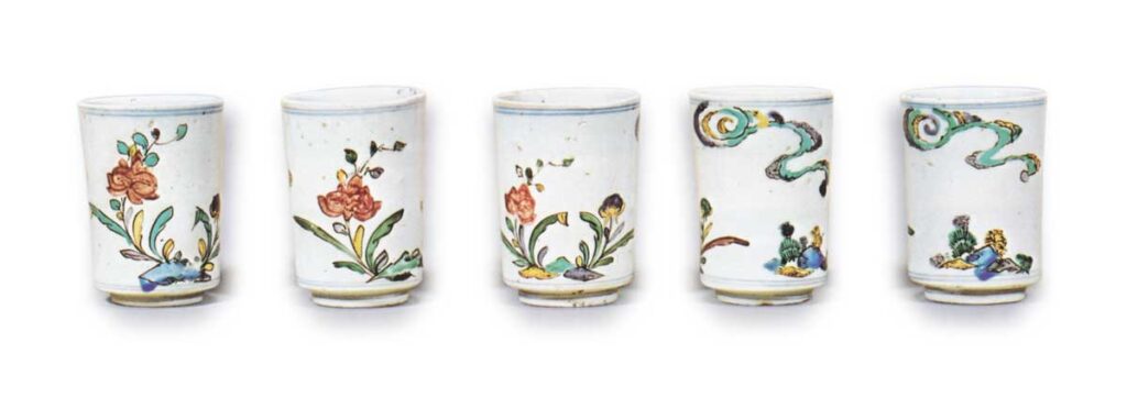 Five wine cups with flowering grass design, enamelled ware