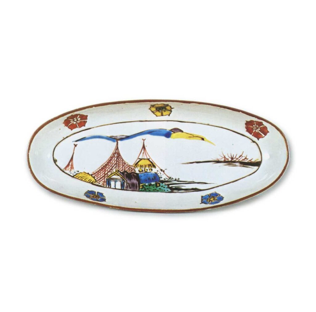 Oval dish with design of landscape with fishing nets, enamelled ware