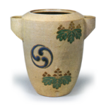 Ninsei: water jar with design of paulownia and tomoe crests, enamelled ware