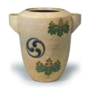 Ninsei: water jar with design of paulownia and tomoe crests, enamelled ware