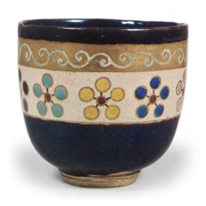 Ninsei: tea bowl with design of stylized plum blossoms, enamelled ware