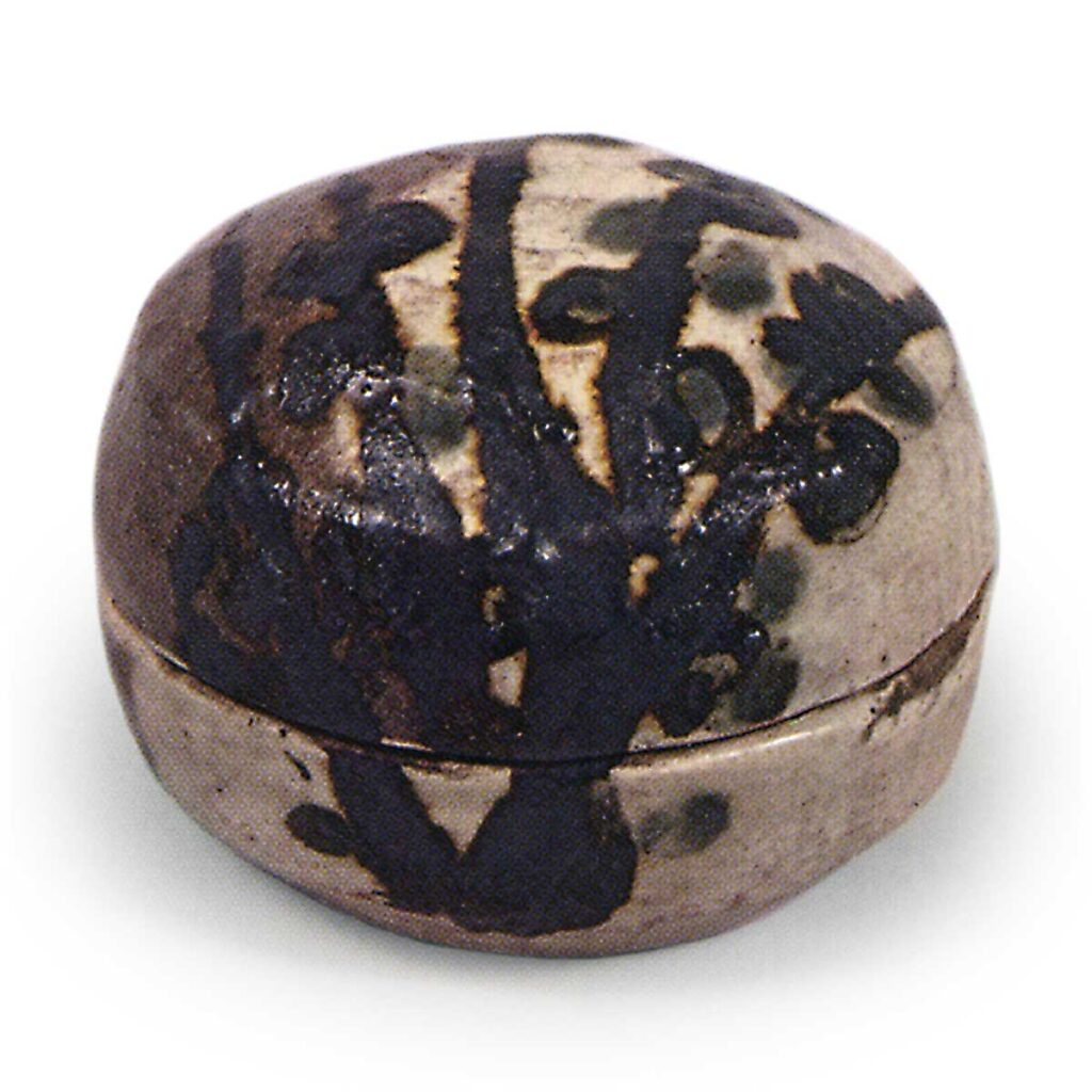 Kenzan incense caddy with plum tree design, iron brown under glaze