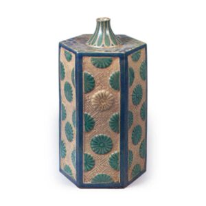 Hexagonal wine bottle with relief chrysanthemum design, enamelled ware