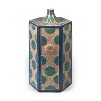Hexagonal wine bottle with relief chrysanthemum design, enamelled ware