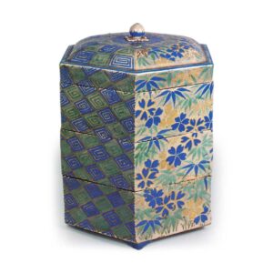 Tiered hexagonal food box with bamboo and plum design, enamelled ware