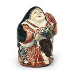 Ninnami: incense caddy in the shape of Otafuku (chubby smiling woman emblematic of happiness), enamelled ware