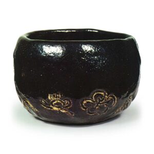 Ryōnyü: tea bowl with pine, bamboo and plum design, Black Raku