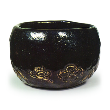 Ryōnyü: tea bowl with pine, bamboo and plum design, Black Raku