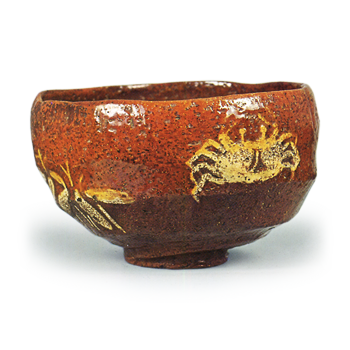 Ōhi V: tea bowl with crab design, amber glaze