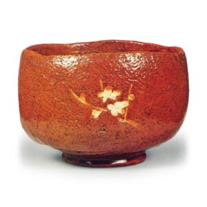 Ōhi IV: tea bowl with plum branch design, amber glaze